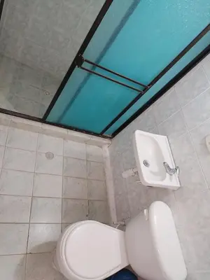 a bathroom with a toilet and a sink at casa de relajacion lowcost in La Dorada