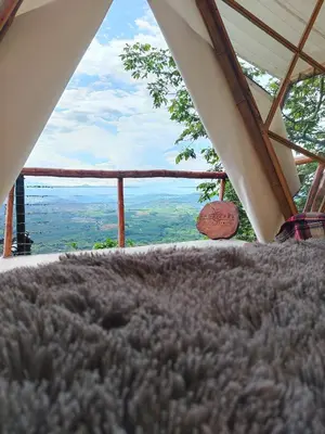 a view from the attic of a room with a view at Glamping Orosierra in Chinchiná