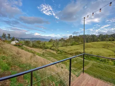 a balcony with a view of a field at Bohemia Glamping in La Unión