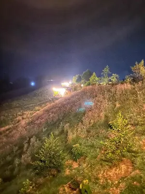 a fire truck parked on a hill at night at Bohemia Glamping in La Unión