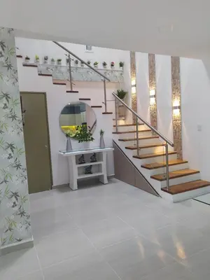 a staircase in a house with a white floor at ALAMEDA MI DESCANSO in Carmen de Viboral