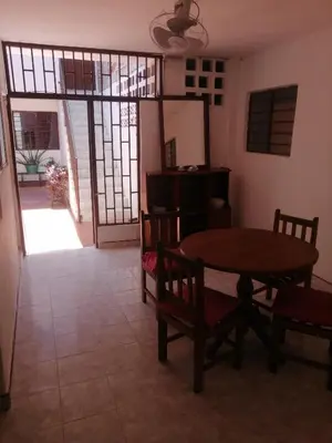 a dining room with a table and chairs in a room at casa la magdalena in La Dorada