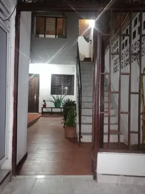 an open door to a hallway with a stair case at casa la magdalena in La Dorada