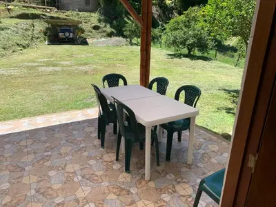 a white table and chairs on a patio at Jardín de la Inmaculada - a 8min del parque in Jardin