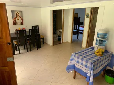 a living room with a table and a dining room at Jardín de la Inmaculada - a 8min del parque in Jardin