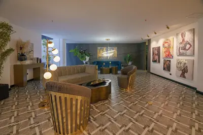a living room with a couch and a table at First Class Hotel in Medellín