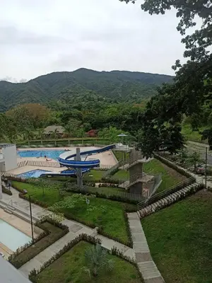 a view of a swimming pool with mountains in the background at Citadela Disole Paraíso in Santa Fe de Antioquia