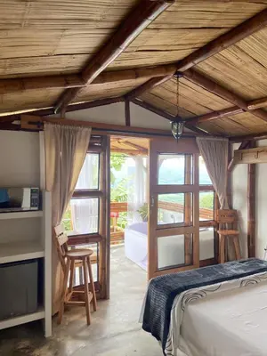 a bedroom with a bed and some windows at Viyamar Glamping: Discover Tranquility in Style in Viterbo