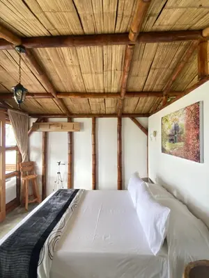 a large bed in a room with a wooden ceiling at Viyamar Glamping: Discover Tranquility in Style in Viterbo