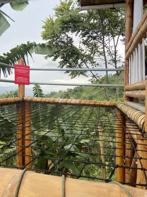 a balcony with a fence with a view of trees at Viyamar Glamping: Discover Tranquility in Style in Viterbo