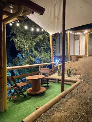 a picnic table under a tent with a table at Viyamar Glamping: Discover Tranquility in Style in Viterbo
