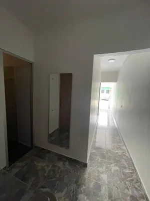 an empty room with a mirror and a hallway at Apartamento vacacional galeón 2 Doradal in Doradal