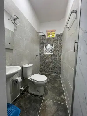 a bathroom with a toilet and a sink at Apartamento vacacional galeón 2 Doradal in Doradal