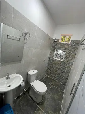 a bathroom with a toilet and a sink at Apartamento vacacional galeón 2 Doradal in Doradal