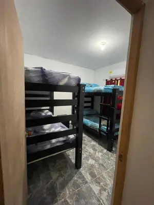 a room with two bunk beds in a room at Apartamento vacacional galeón 2 Doradal in Doradal