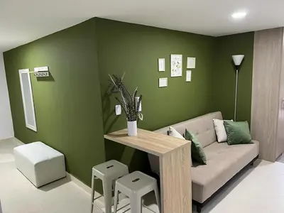 a living room with a couch and a table at Urban 102 in Manizales
