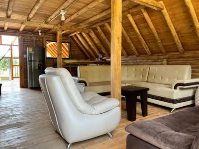 a living room with white furniture and wooden ceilings at chalets A-MAR By la malcriada in Guarne