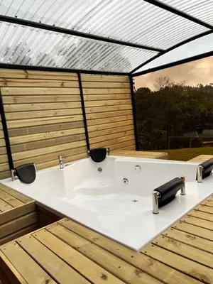 a bath tub in a bathroom with a roof at chalets A-MAR By la malcriada in Guarne