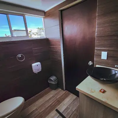 a bathroom with a sink and a toilet at Hotel Ocaso Marinilla in Marinilla
