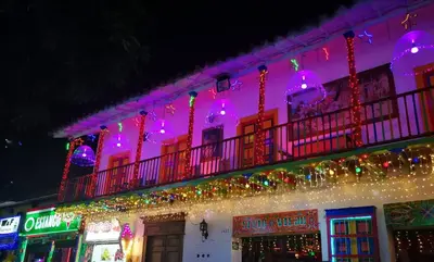 a building with christmas lights on the side of it at Hermosa casa en el mejor lugar! in Sabaneta