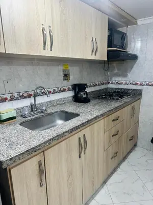 a kitchen with a sink and a counter top at Acogedor apartamento cerca al centro de Medellin in Medellín