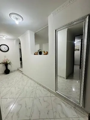 a large mirror on a wall in a hallway at Acogedor apartamento cerca al centro de Medellin in Medellín