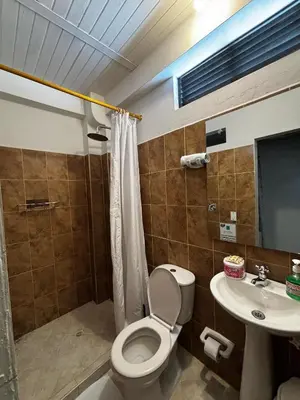 a bathroom with a toilet and a sink at cabaña82 in Puerto Triunfo