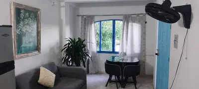 a living room with a couch and a table at cabaña82 in Puerto Triunfo