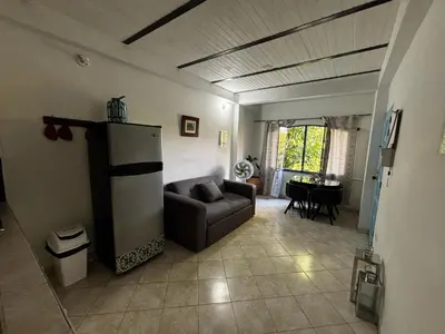 a living room with a couch and a table at cabaña82 in Puerto Triunfo