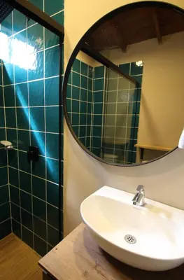 a bathroom with a sink and a mirror at Apartamento cerca Unidad Deportiva Belén - ONE202 By Roots Rentals in Medellín