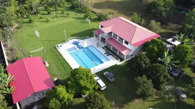 an aerial view of a house with a swimming pool at QUINTA CAMPESTRE LA FLORIDA in Mariquita