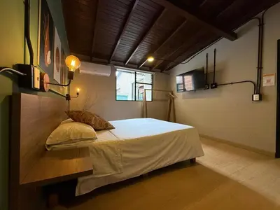 a bedroom with a large bed in a room at Apartamento Centro Comercial los Molinos - ONE203 By Roots Rentals in Medellín