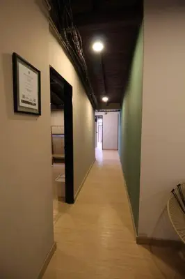 a hallway with a long hallway with a room with a hallwayngthngthngthngth at Apartamento cerca a clínica las Américas - ONE204 By Roots Rentals in Medellín