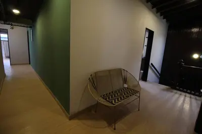 a chair sitting in the middle of a room at Apartamento cerca a clínica las Américas - ONE204 By Roots Rentals in Medellín