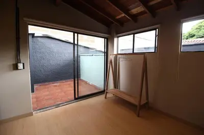 an empty room with a sliding glass door with a patio at Apartamento cerca a clínica las Américas - ONE204 By Roots Rentals in Medellín
