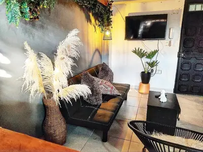a living room with a couch and a table at Alejandría 1 in Itagüí