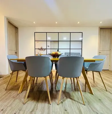 a dining room with a table and chairs at Modern, Apt/near tourist sites. in Medellín