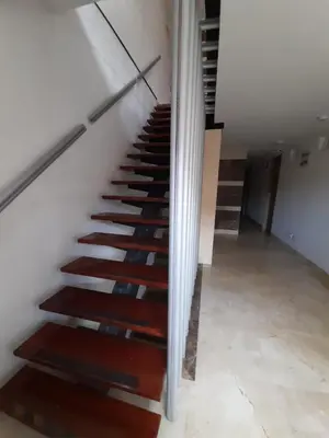 a staircase in a house with wooden steps at Hotel Park Caribe in Medellín