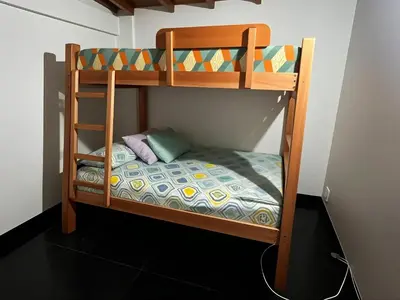 a bunk bedded room with a bunk bed in a room at Aparta Suite Torre De Prado 501 in Medellín