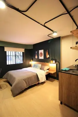 a bedroom with a large bed in a room at Apartamento doble con baño privado y Wifi -ONE101 By Roots Rentals in Medellín