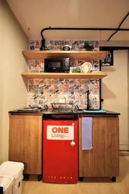 a kitchen with a one living sign on a counter at Apartamento doble con baño privado y Wifi -ONE101 By Roots Rentals in Medellín