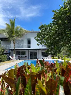 a view of a house with a pool and trees at La Martina Palestina in Palestina