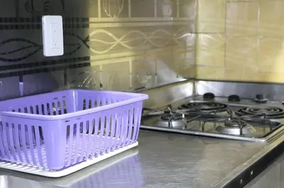 a purple basket sitting on top of a stove at Hermosa casita cerca al centro in Medellín