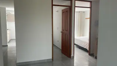 a hallway with a door leading to a bedroom at Casa linda San Carlos in San Carlos