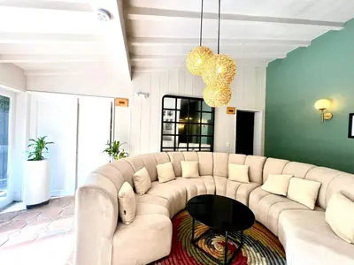 a living room with a couch and a table at Luxury Villa In Aguacatala2 in Medellín