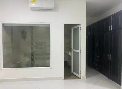 a room with black cabinets and a glass door at APARTAMENTO DORADAL in Doradal