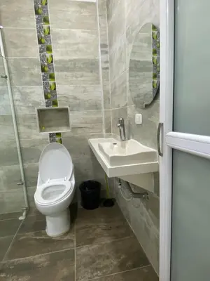 a bathroom with a toilet and a sink at APARTAMENTO DORADAL in Doradal