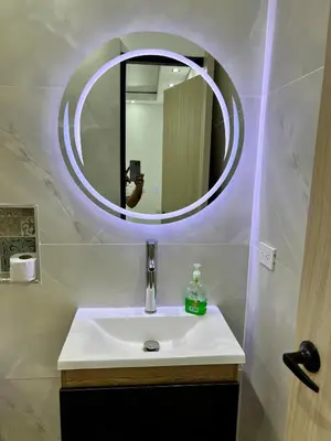 a bathroom with a sink and a mirror at HOTEL TORRE DELUXE ¨SANTORINI¨ in Doradal