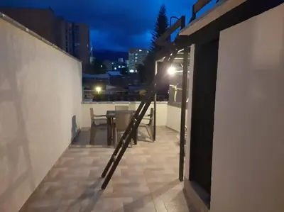 a balcony with a light on the side of a building at Gorgeous Penthouse Apartment in Medellin in Medellín