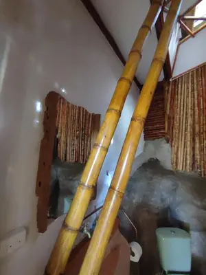 a group of bamboo poles on the wall of a room at El Turpial in Jericó